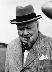 02 Sep 1949, London, England, UK --- British statesman Winston Churchill in 1949, smoking one of his beloved cigars as he leaves the plane that brought him back from a continental holiday. He caught cold while swimming on the Riviera, but soon recovered. --- Image by © Bettmann/CORBIS