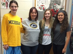From left, Natalie Harshman, teacher Faye Valtadoros, Rachel Wright and Madilyn Mason are ready for their trip to Japan.  Photo provided