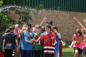 There is nothing like a spray of the hose to cool these students down.