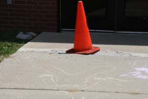 A cone marks an unsafe walkway.