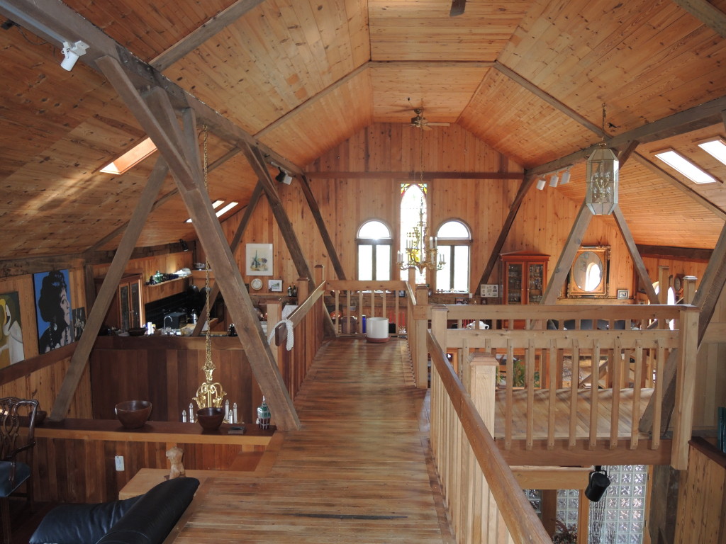 Wood sculptor Paul Gonzalez converted a 176-year-old barn into a hand-finished wood home. 