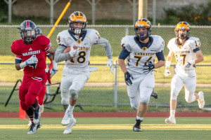 Jake Buchmann speeds ahead of Southfield Arts & Technology players in last Friday’s game. Photo by Larry Wright
