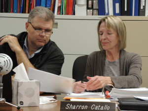 Mayor Joe Luginski and City Council member Sharron Catallo review a petition regarding parking concerns downtown, at the Oct. 10 council meeting. Photo by Phil Custodio