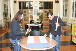 Senior Sebastian Marquez and junior Jeannie Stevens make Random Act of Kindness posters for an upcoming community forum. Photo by Jessica Steeley