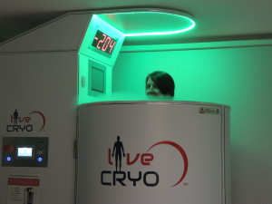 Kristi Kaer of Clarkston Area Chamber of Commerce tries out the new cryo chamber. Photos by Phil Custodio