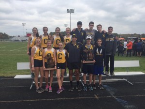The Clarkston Boys and Girls Cross Country teams celebrate their win at the MHSAA Regional meet, Oct. 29. Photo provided