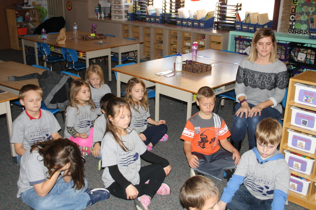 First graders in Ms. Hothems' class at North Sashabaw Elementary demonstrate mindful moments. Photo by Jessica Steeley