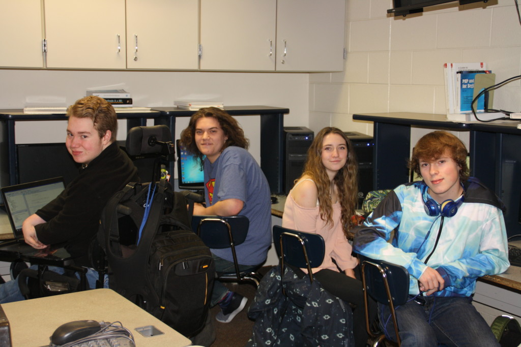 Clarkston High School seniors, from left, Reilly Parent, Devin Radzwion, Kate Campbell, and Gavin Slater, in their AP Computer Science class. Photo by Jessica Steeley  