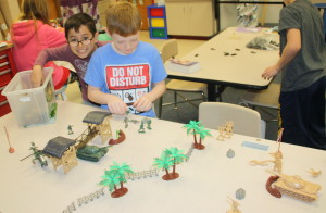Fourth graders Aiden Jones and Matthew Carrillo play with their heroes set. Photos by Jessica Steeley
