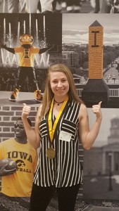 Emma Lohmeier with her medal at the  University of Iowa. Photo provided