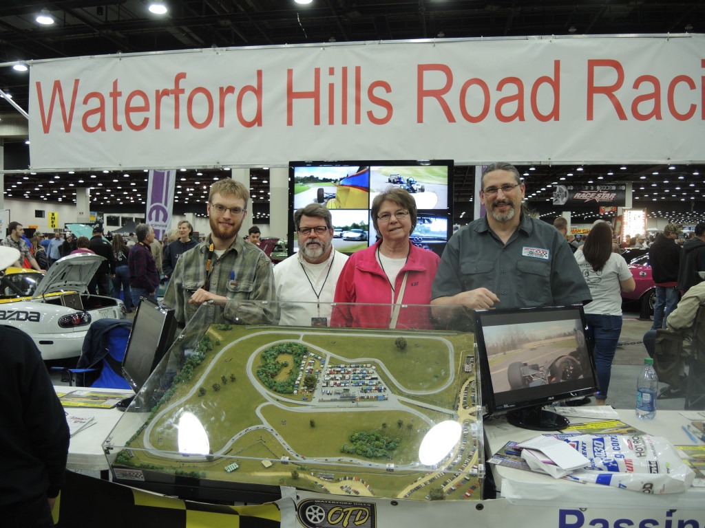 From left, Todd Geiser, Chip Bliem, Kay Bliem, and Ed Frank of Waterford Hills Road Race track in Independence Township set up shop at Autorama to talk cars and racing.