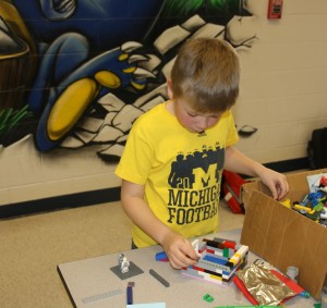 second grader Max Olson building in the Lego competition 2