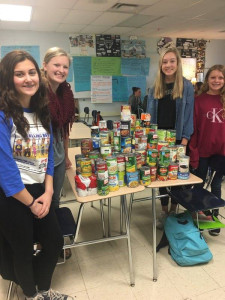 Students Megan Zabinski, Abby Sherwood, Mackenzie Kersten, Anna Conforti, and Hailee Maynard, not pictured, are collecting food for families in need of help. Photo provided