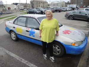Kathleen Weger hopes to spread awareness of autism with the help of her car. Photo by Phil Custodio