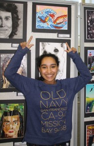 Daejah Sotelo, senior, pointing to her piece