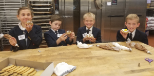 Everest Academy Second Graders  decorate cookies at Neiman's. Photo provided