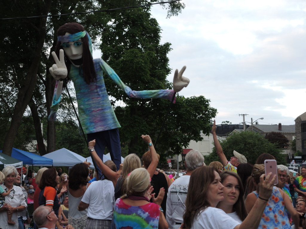 Magic Bus’ mascot Mr. Cool greets the crowd in Depot Park.