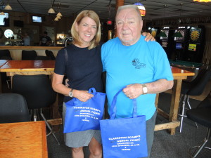 Aimee Baker, SCAMP executive director, and longtime SCAMP volunteer John Spokaeski are hard at work, organizing the annual picnic at Independence Oaks. Photo by Phil Custodio