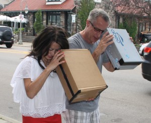 Stephanie Tran and Scott Stanley look at Monday's eclipse through box viewers. Photo by Jessica Steeley 