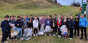 Clarkston Boys and Girls Ski teams help clean up the slopes at Pine Knob Ski and Snowboard Resort to kick off the winter season. Photo: Provided by Brian Popelier